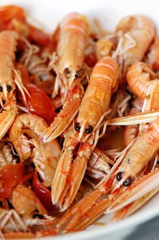 closeup of dish with scampi and tomatoes
