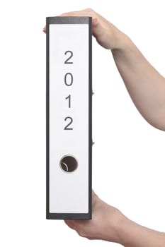 Two hands of a woman holding a folder spine