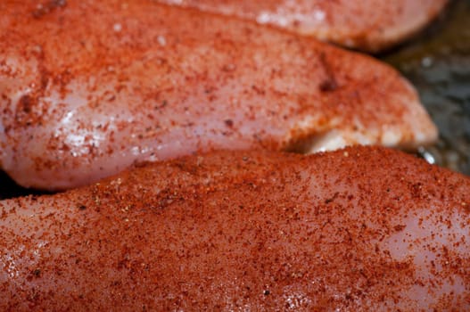 Chicken breast with peppers is fried in the frying pan