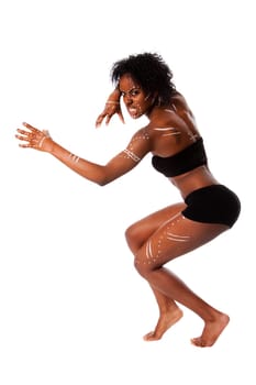 Beautiful African indigenous tribal fashion female warrior with white dots and stripes and aggressive expression, isolated.