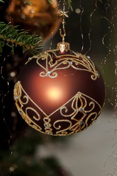 Decorative Christmas balls hanging on pine - tree branch