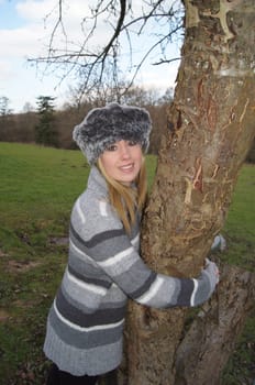 Girl Hugging a Tree