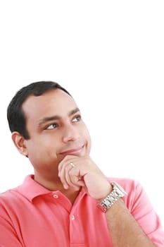 Portrait of a thoughtful young guy standing looking away on white background