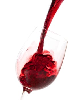 Red wine pouring into glass
