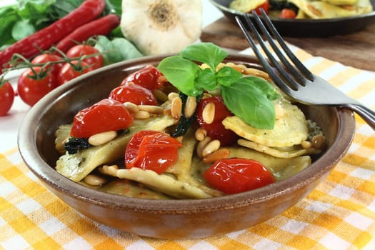 Cappelletti with melted tomatoes and roasted pine nuts