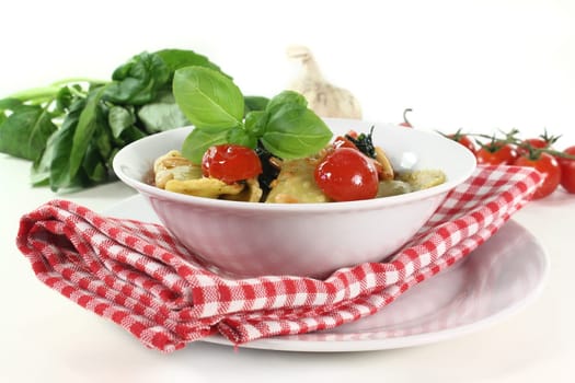 Cappelletti with melted tomatoes and roasted pine nuts