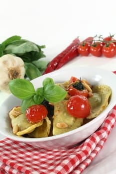Cappelletti with melted tomatoes and roasted pine nuts