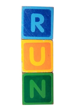 toy letters that spell run against a white background with clipping path