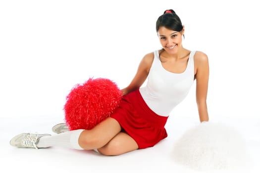 Young lady cheerleader posing in the studio, isolated on white