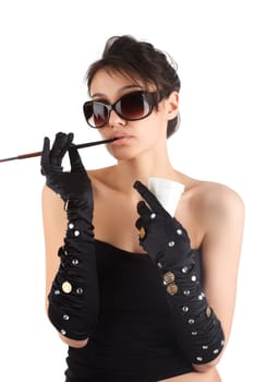 Portrait of a young attractive woman with cigarette holder.