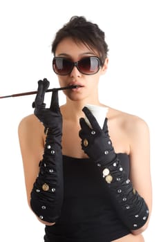 Portrait of a young attractive woman with cigarette holder.