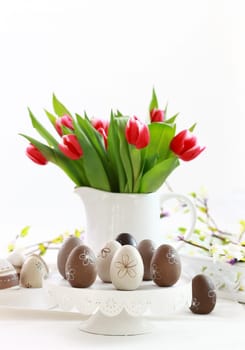 Easter eggs with tulips as table decoration