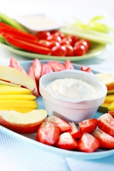 Raw fruits and vegetables with cream cheese and yogurt dip