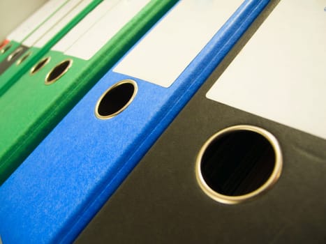 Ring binder in a row in perspective view
