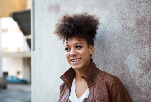 Portrait of a beautiful smiling young woman outdoors.