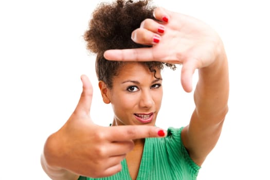 Portrait of a beautiful woman creating a frame with her fingers. Studio shot with isolated white background.