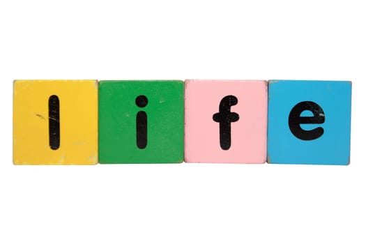 toy letters that spell life against a white background with clipping path