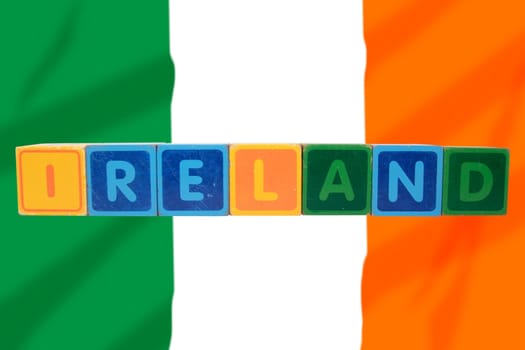 toy letters that spell ireland against a flag background with clipping path