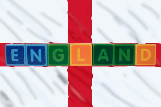 toy letters that spell england against a flag background with clipping path