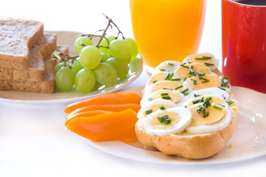 Breakfast with egg on bread rolls