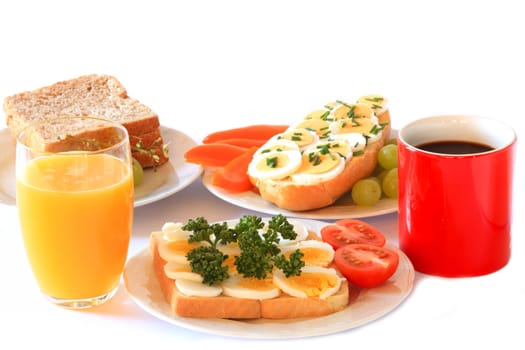 Breakfast with egg rolls,coffee and orange juice