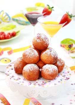 Small fried doughnut with cocktails for carnival