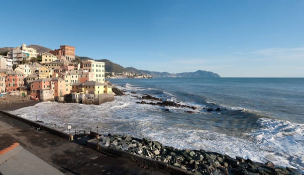 overview of the village of Boccadasse with rough seas