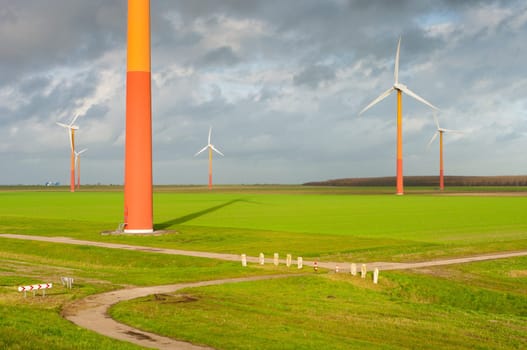 windmill farm with colorful windmills in Almere, netherlands