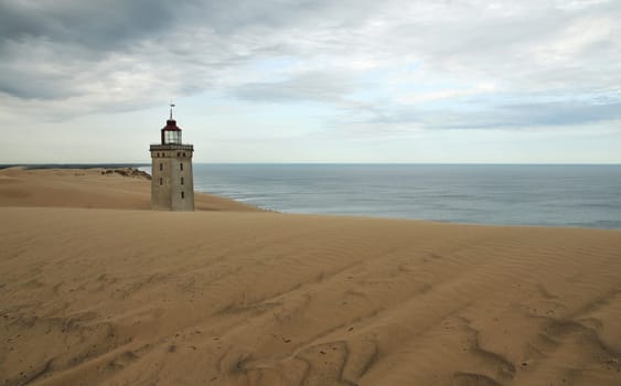 Old lighthouse in the shifting dune near Rubjerg / Denmark