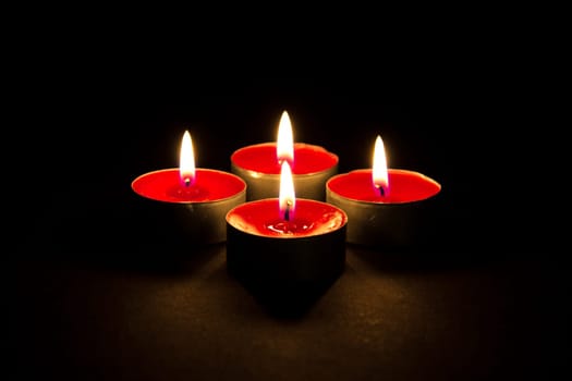 Red candles in the dark