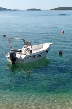 boat on the clear sea of Sibenik in Croatia