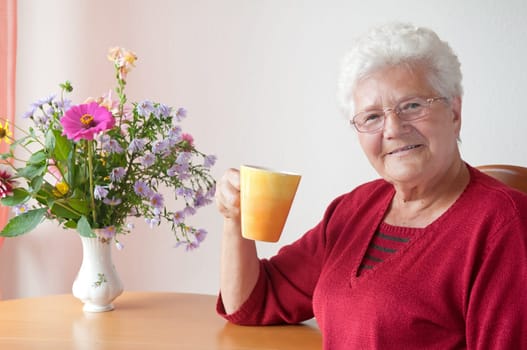 Senior woman with cup