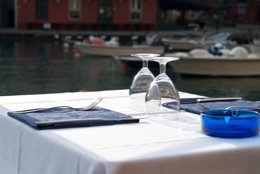 table set on the harbor of Portofino