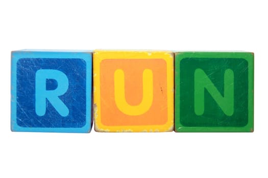 toy letters that spell run against a white background with clipping path