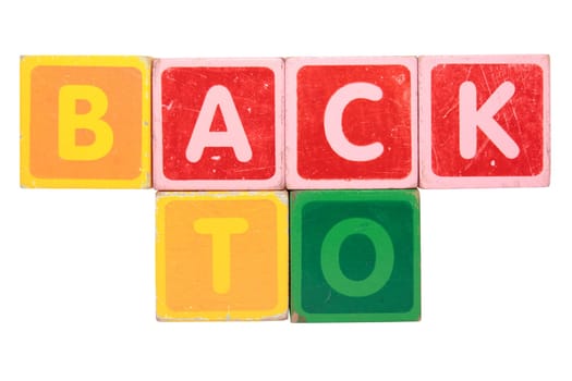 toy letters that spell back to against a white background with clipping path