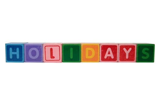 toy letters that spell holidays against a white background with clipping path