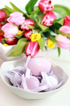 Easter eggs with tulips as table decoration