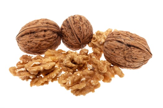 Walnut,fruit in and without shell against white background
