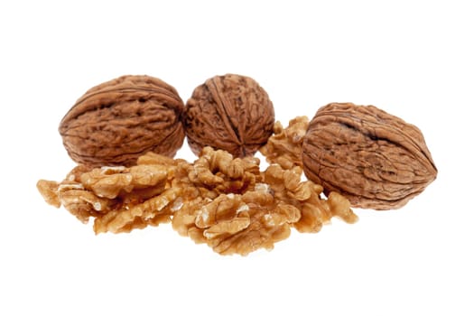 Walnut,fruit in and without shell against white background
