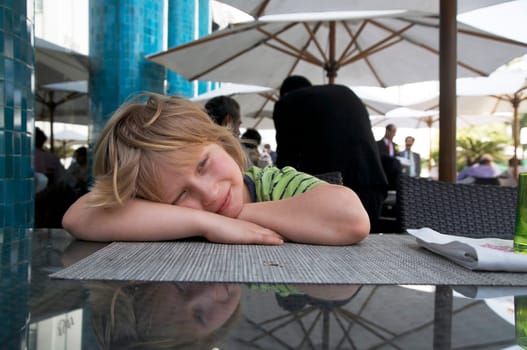 Boy sitting in restaurant
