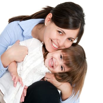Close up portrait of friendly mother and her daughter. Isolated on white background.