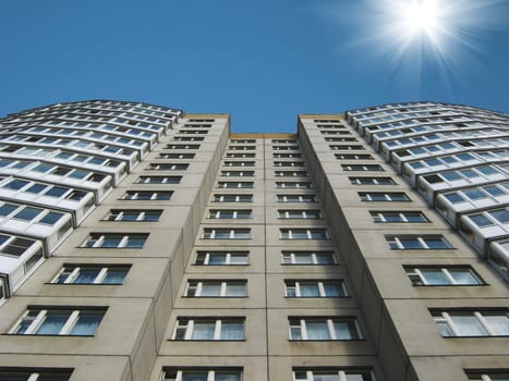 The high house against the sky and the sun