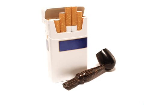 Pack of cigarettes and pipe on a white background