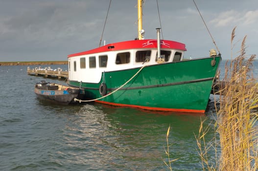 fishing trawler with small boat