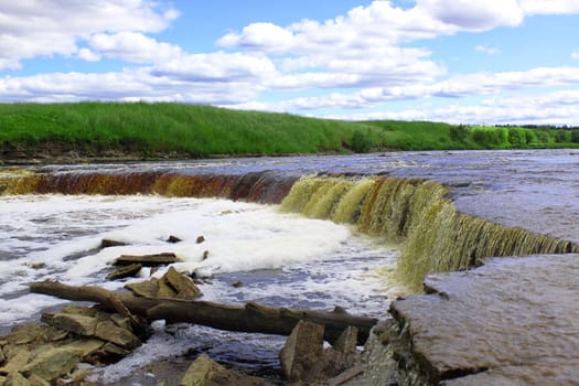 Beautiful wild landscape with waterfall