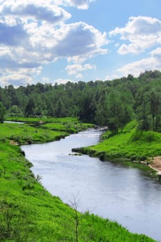Beautiful landscape with river and blue cloudy sky