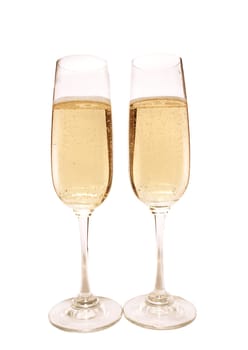 Two glasses with champagne on a white background