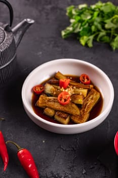 fried eggplant in soy sauce with garlic