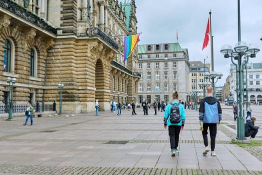 Hamburg, Germany, 1.08.2023, Hamburg city center, LGBT rainbow flag, people passing passersby tourists