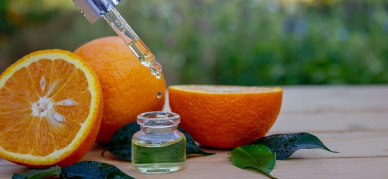 Essential oil extract of orange oil. Selective focus. Nature